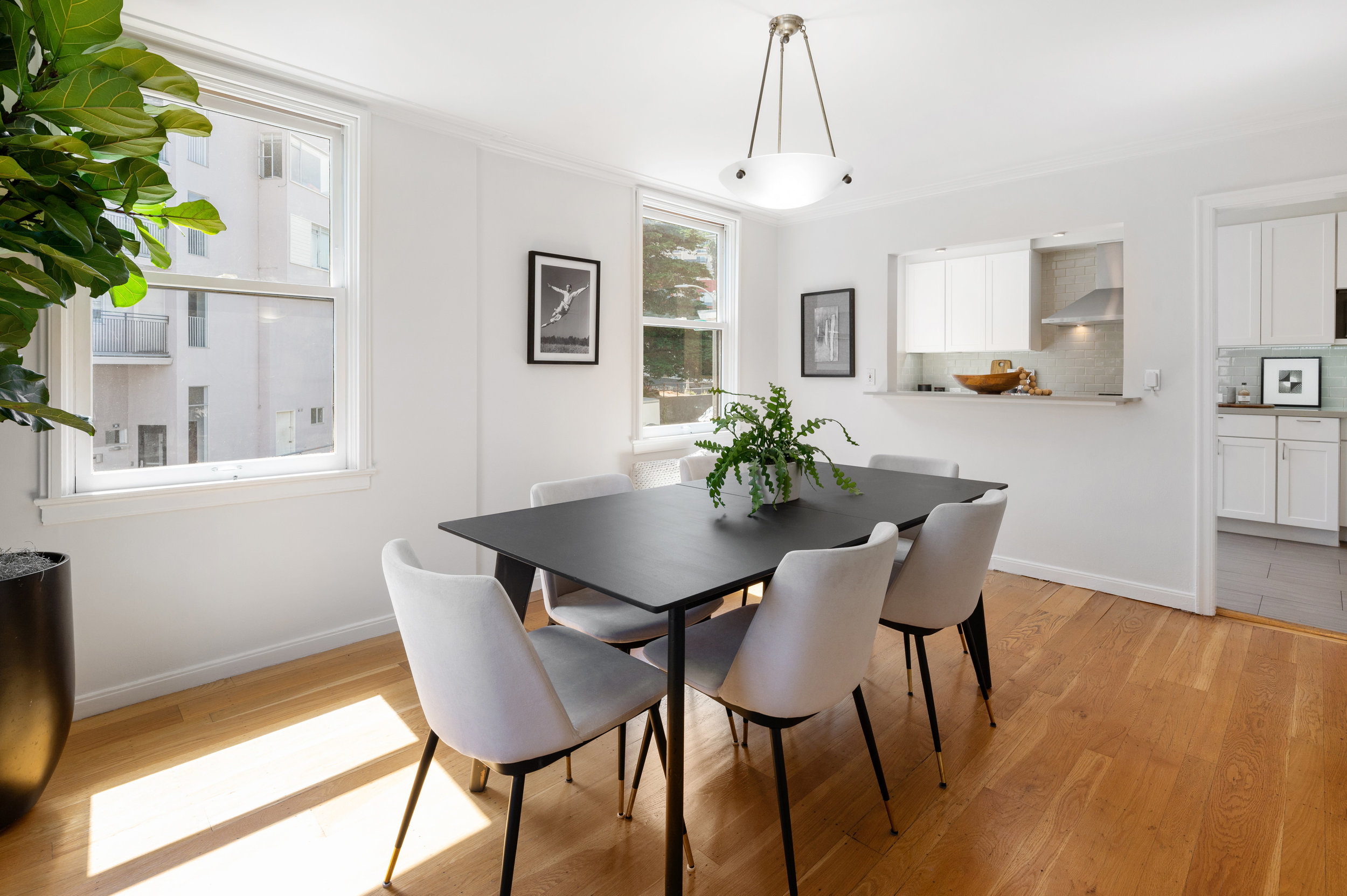 Property Photo: Dining room with an interior buffet kitchen window