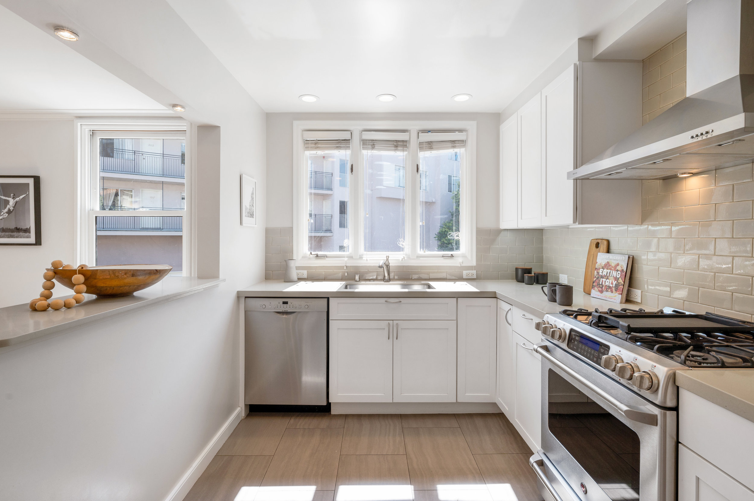 Property Photo: Chef's kitchen with high-end appliances and lux cabinetry 