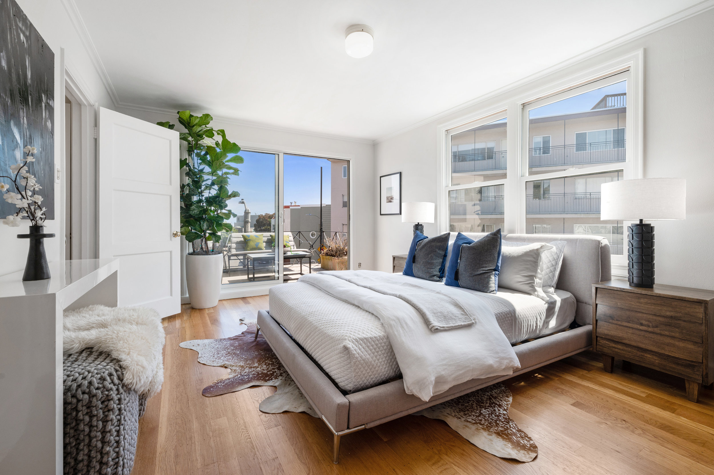 Property Photo: Second bedroom featuring wood floors