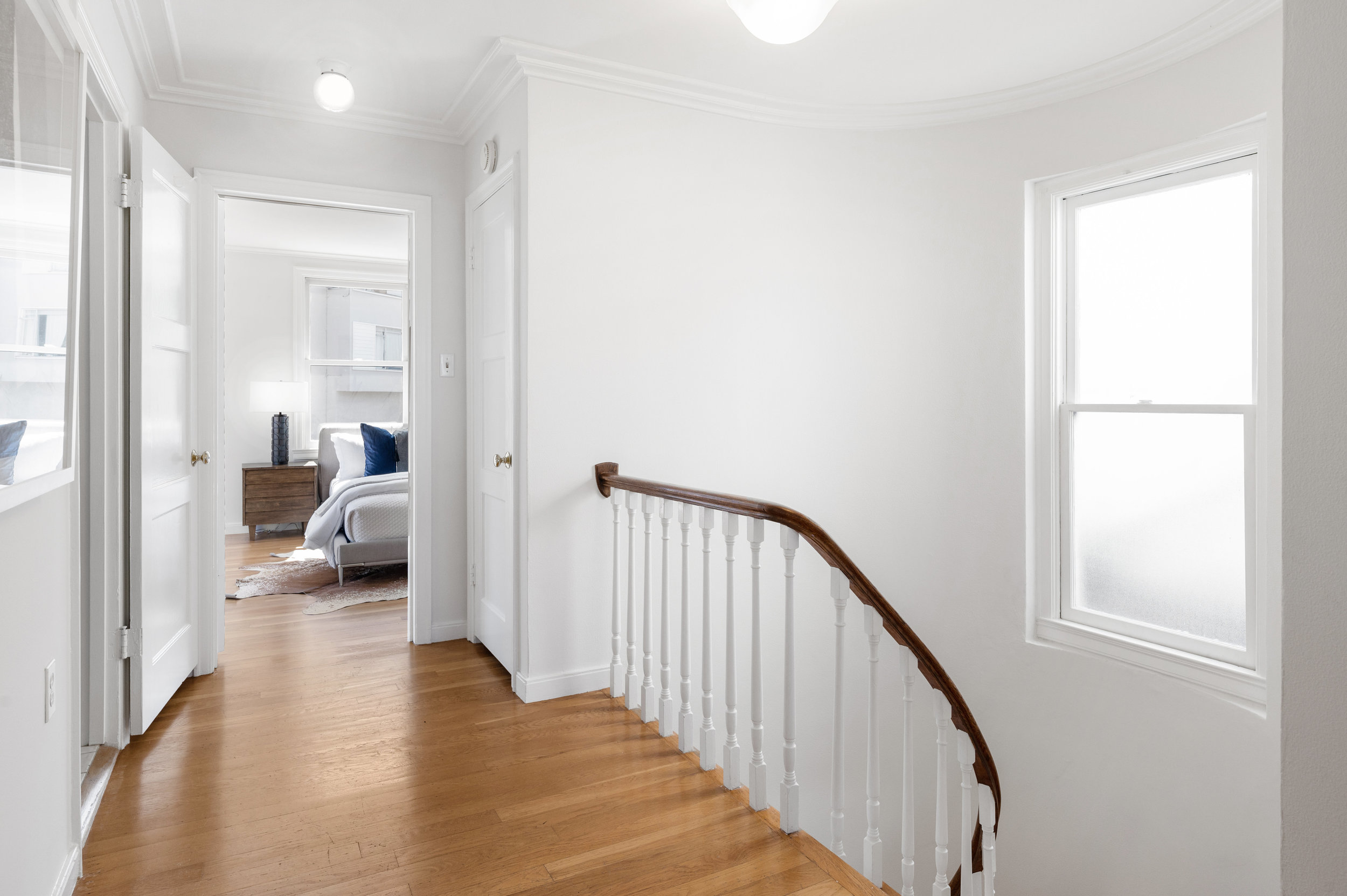 Property Photo: View of the upper hall and steps leading down