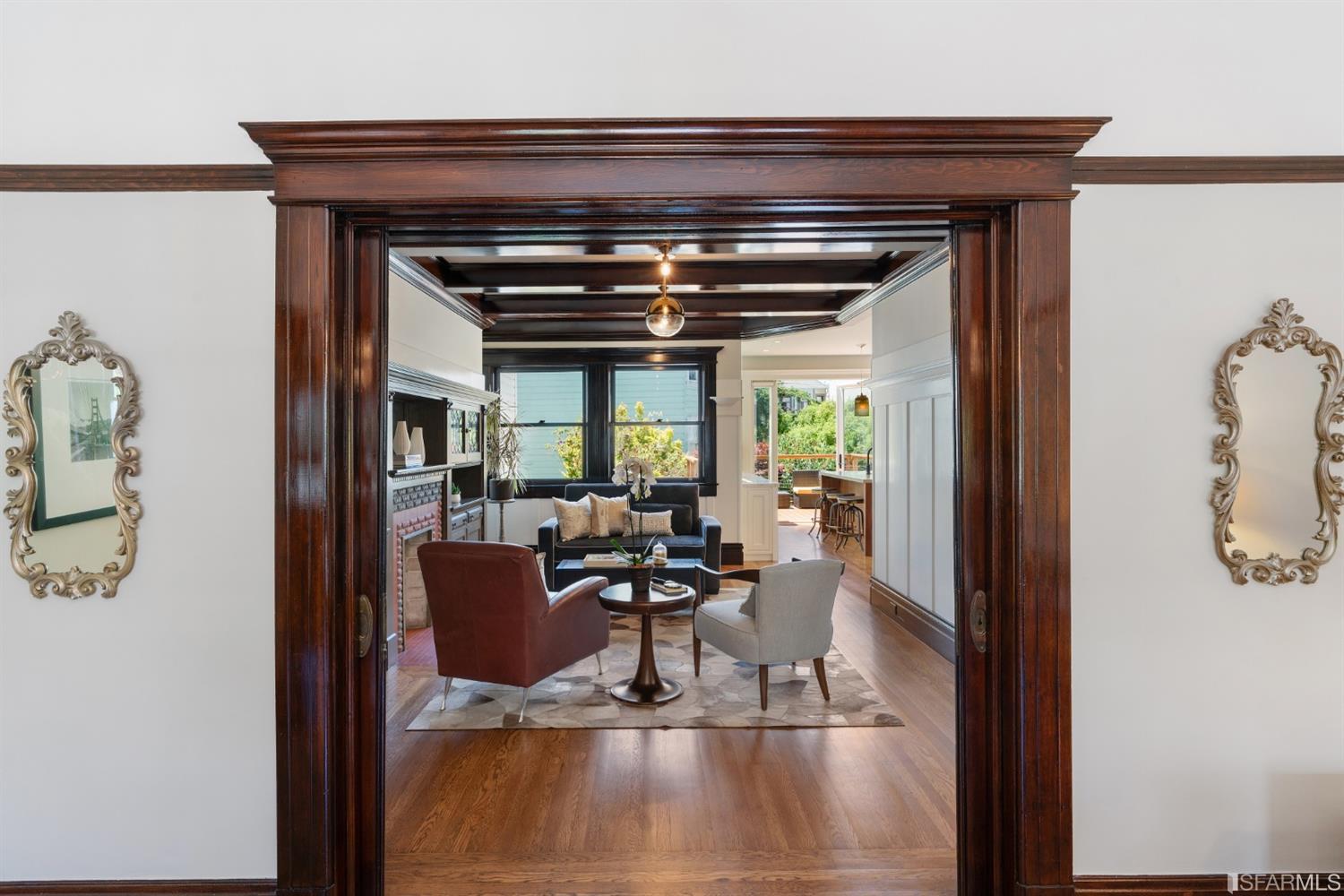 Property Photo: View of the living area as seen through a beautiful wood-framed door-way