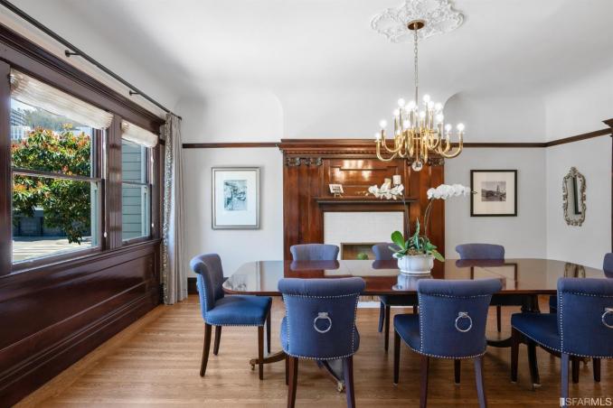 Property Thumbnail: View of the formal dining room, featuring an elegant chandelier and large windows