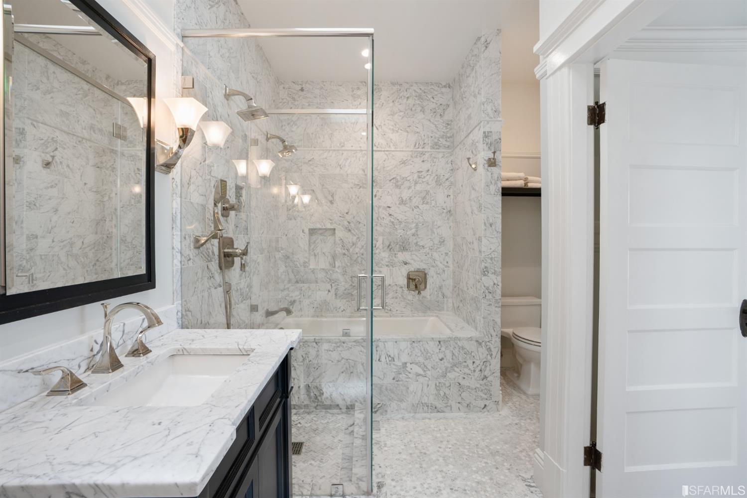 Property Photo: Bathroom with a shower and bath tub