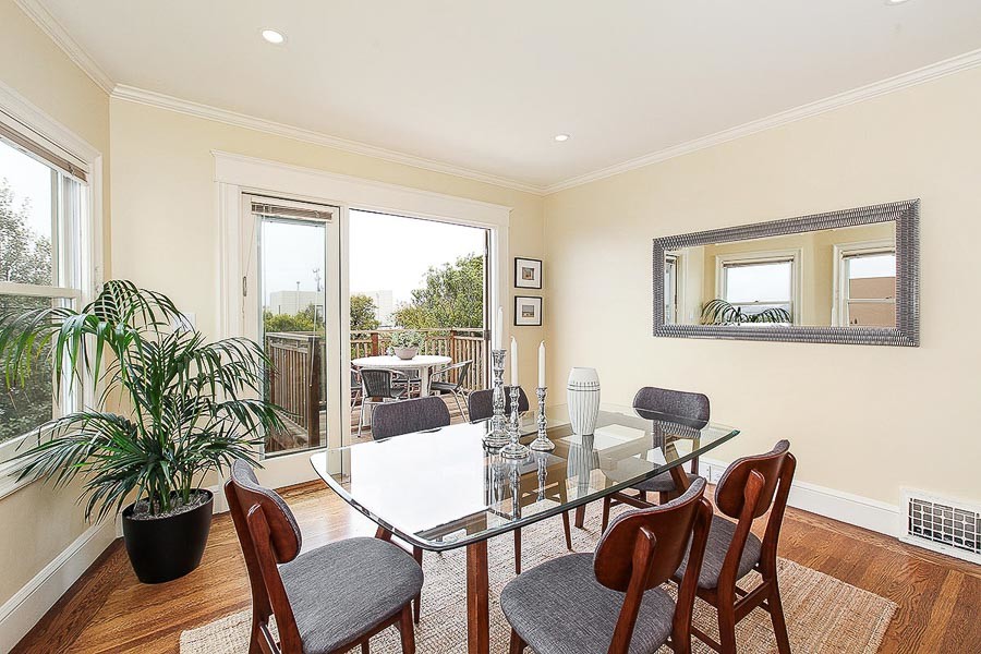 Property Photo: View of the dining room, with an exterior door leading to outdoor dining space