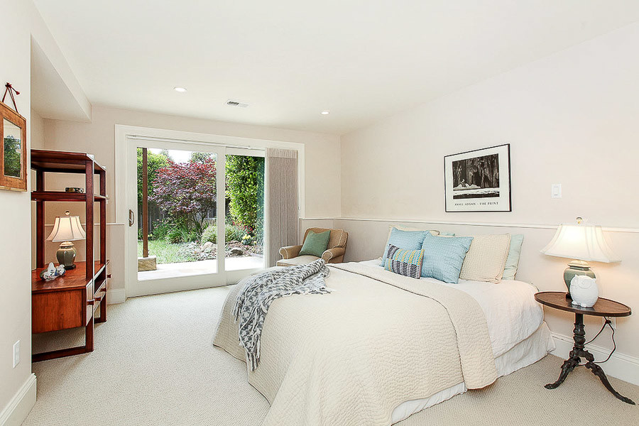 Property Photo: View of another bedroom with a large exterior door to the back yard