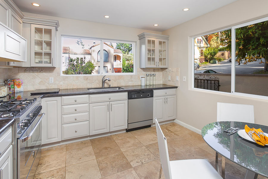 Property Photo: View of the kitchen with two large windows