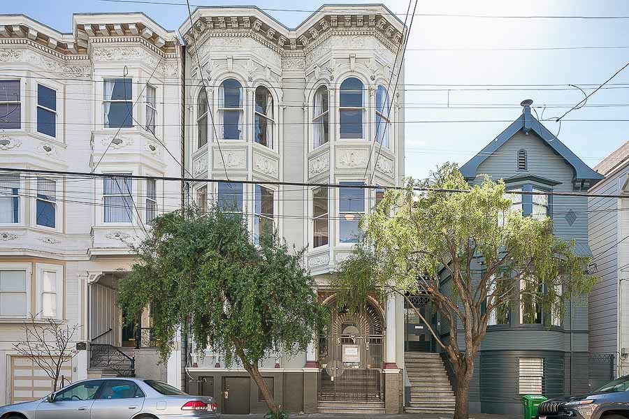 Property Photo: Front exterior view of 441 Waller Street, showing a cream-colored home