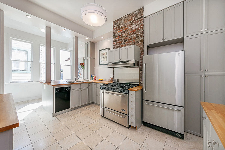 Property Photo: Kitchen, featuring tall cabinetry 