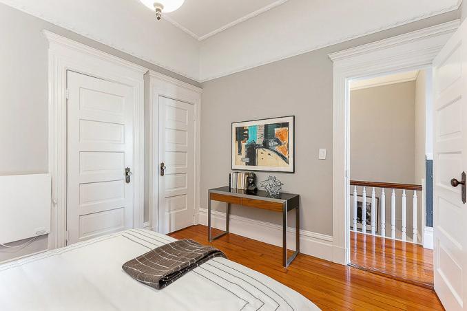 Property Thumbnail: View of a bedroom with wood floors and crown moulding 