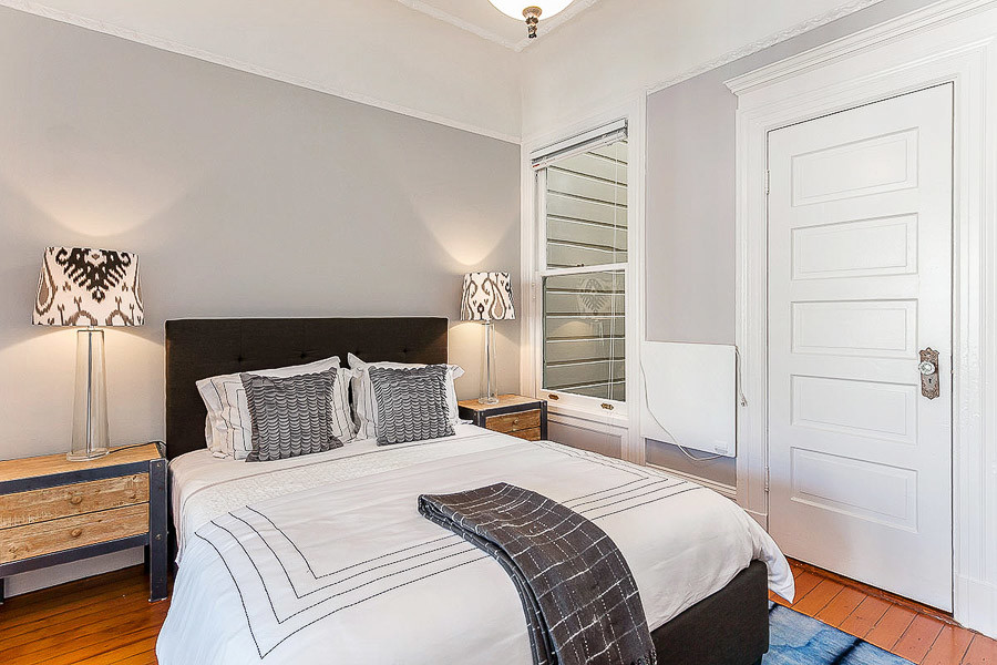 Property Photo: Bedroom with wood floors 