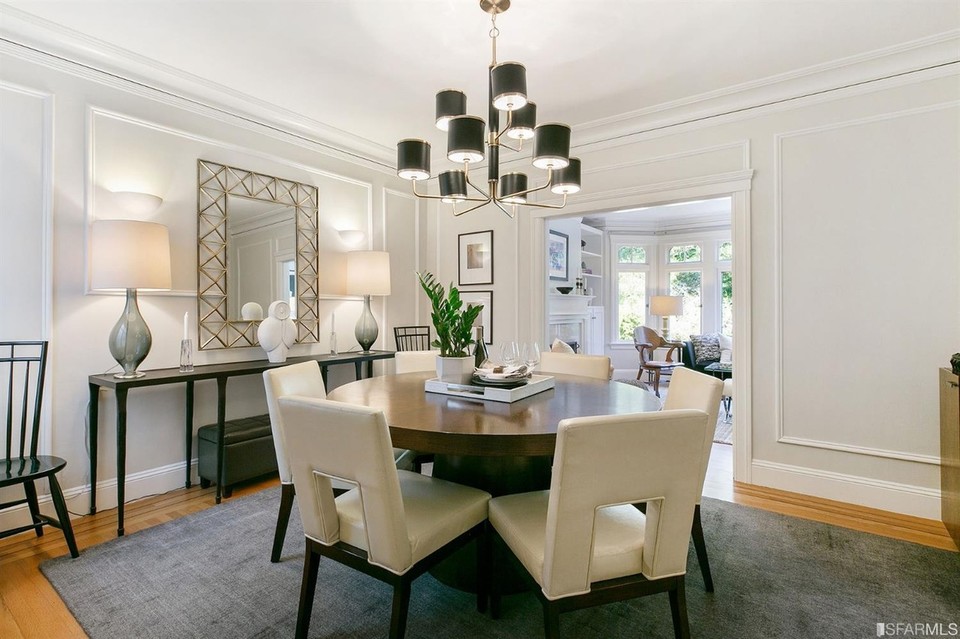 Property Photo: View of the formal dinning room with wood floors