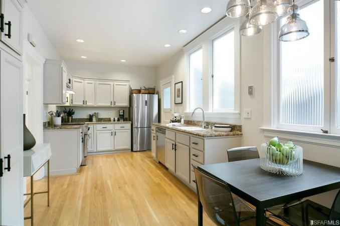 Property Thumbnail: View of the kitchen, featuring light-colored cabinets