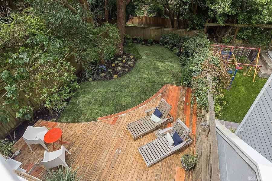 Property Photo: View of the lower deck and yard from above