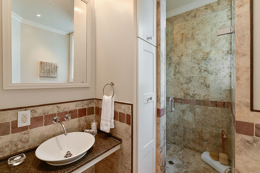 Property Photo: Bathroom with marbled tile