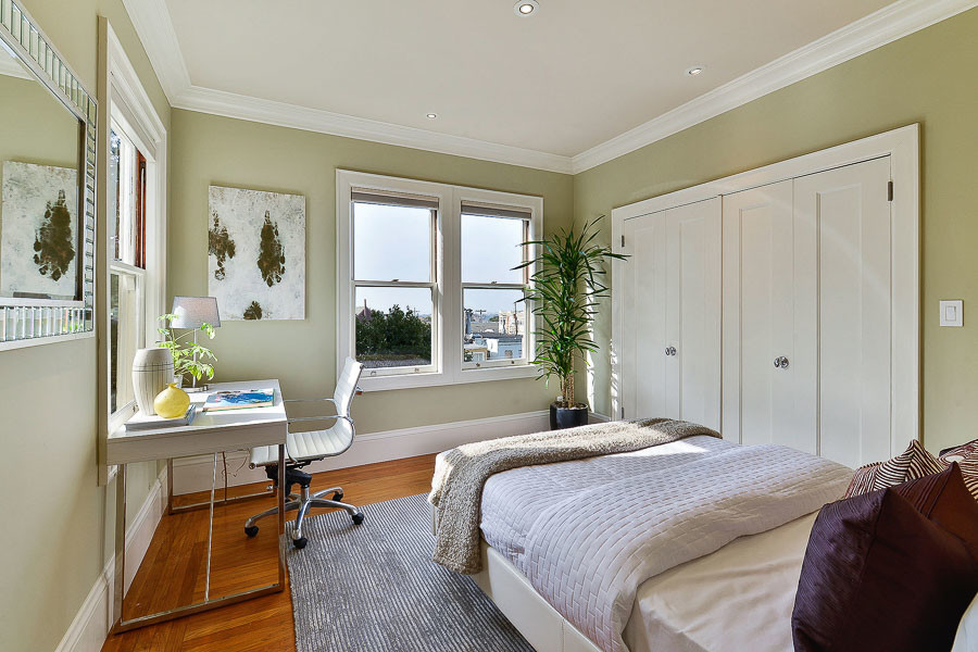 Property Photo: View of a bedroom with large windows and closet