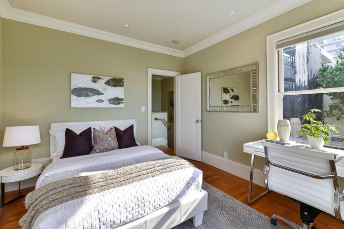 Property Thumbnail: Bedroom with wood floors and crown moulding 