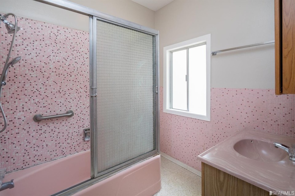 Property Photo: Bathroom with pink tile