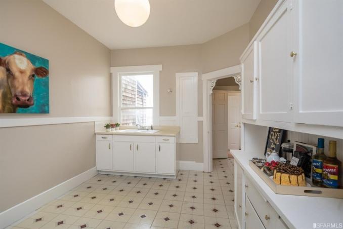 Property Thumbnail: View of the kitchen, featuring white cabinets