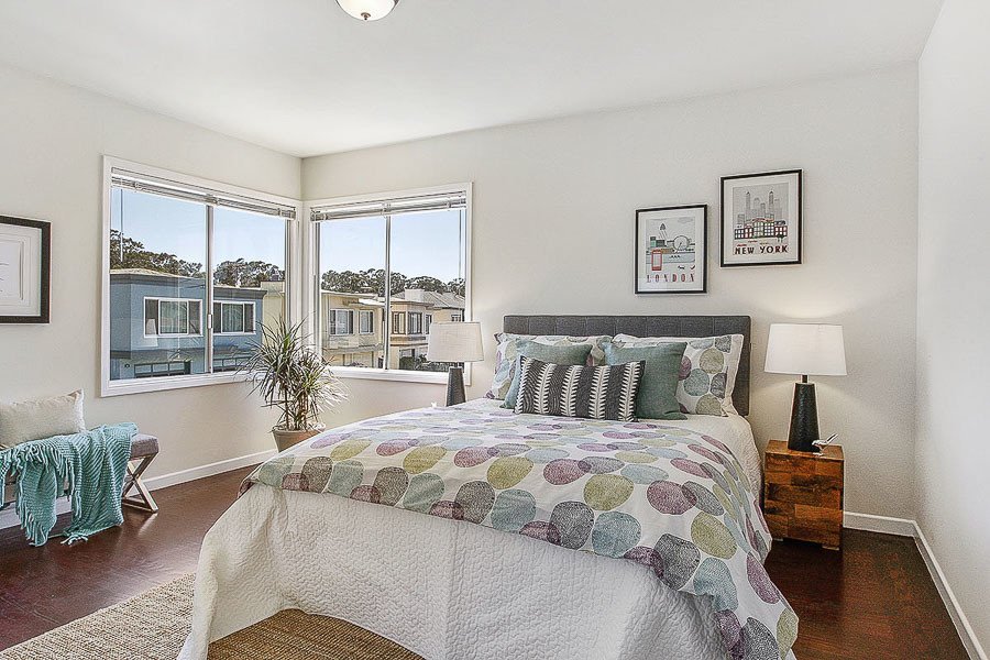 Property Photo: View of a large bedroom with corner windows