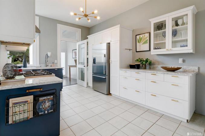 Property Thumbnail: Kitchen, featuring white cabinets and tile floor