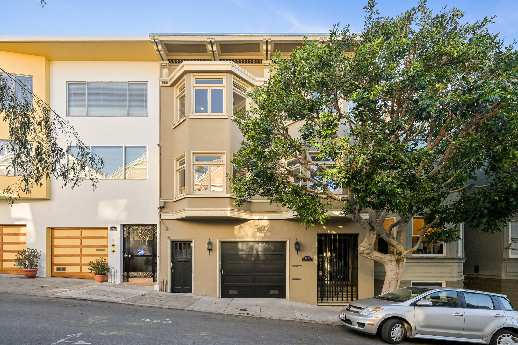 001001-2 Exterior view of 39 Delmar street. Showing a home with tan facade