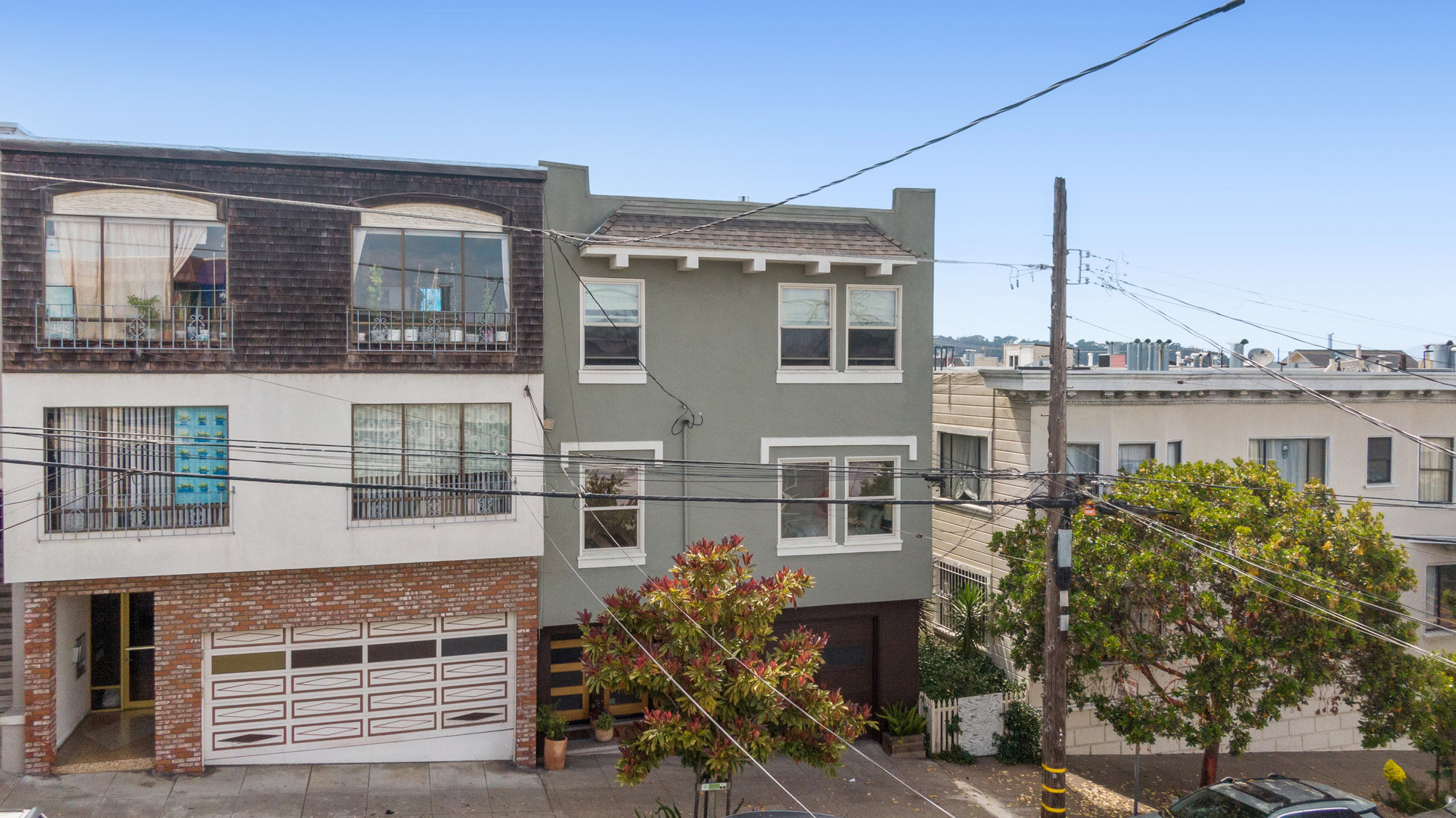 Front exterior view of 719 18th Avenue, showing a home with green facade
