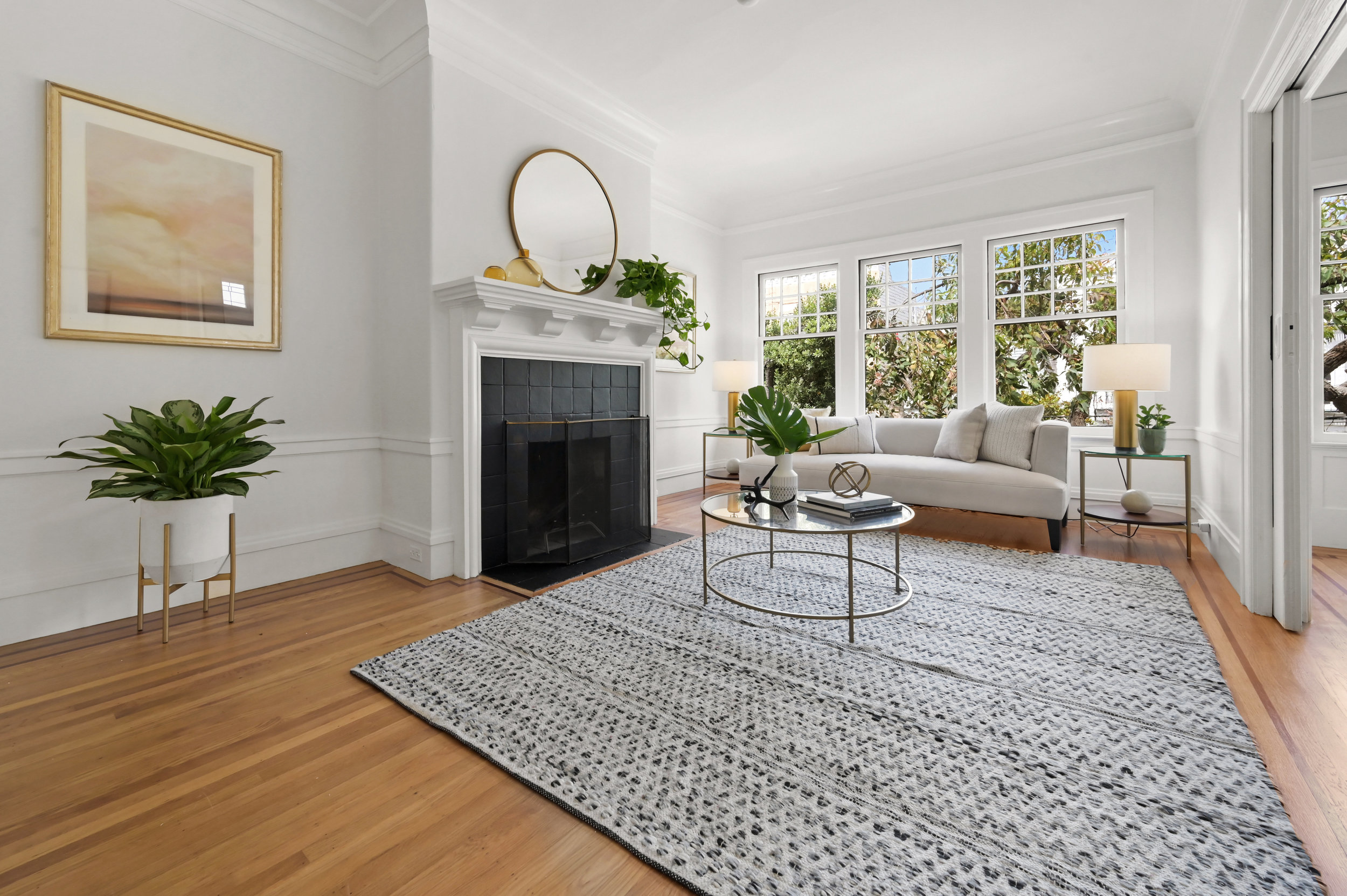 Living room featuring a fireplace and wood floors