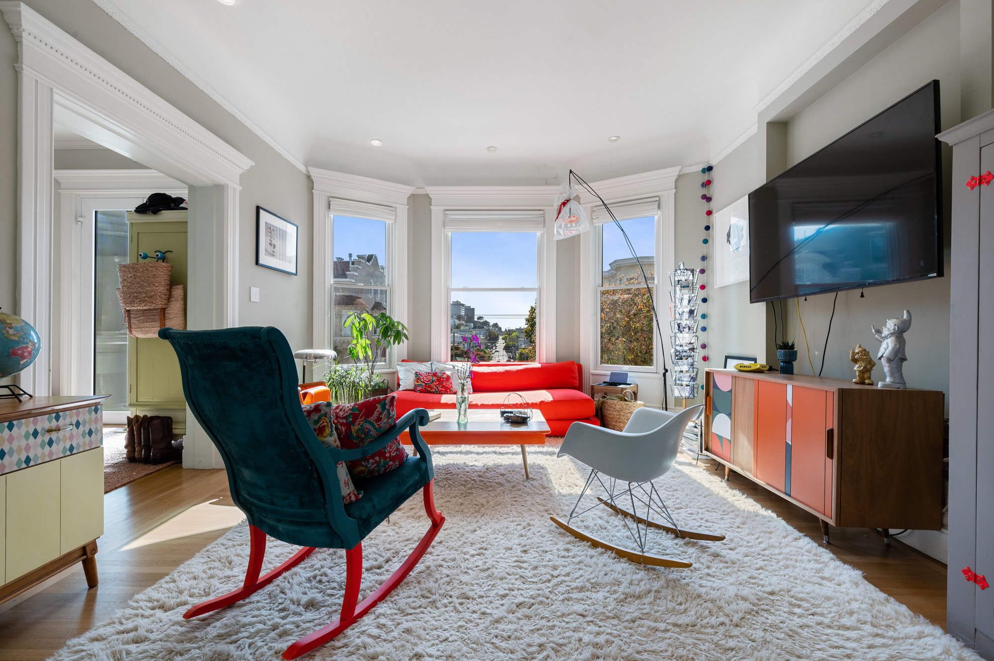 View of the living room featuring large bay windows