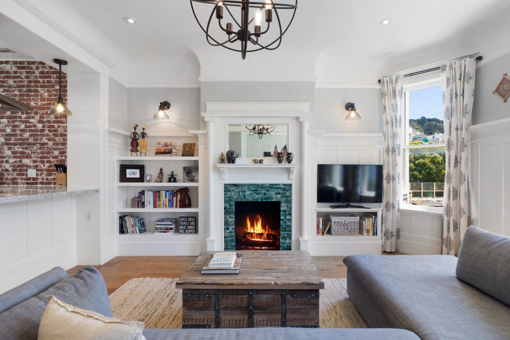 View of the living room at 1473 Waller Street, showing a fireplace with tile surround