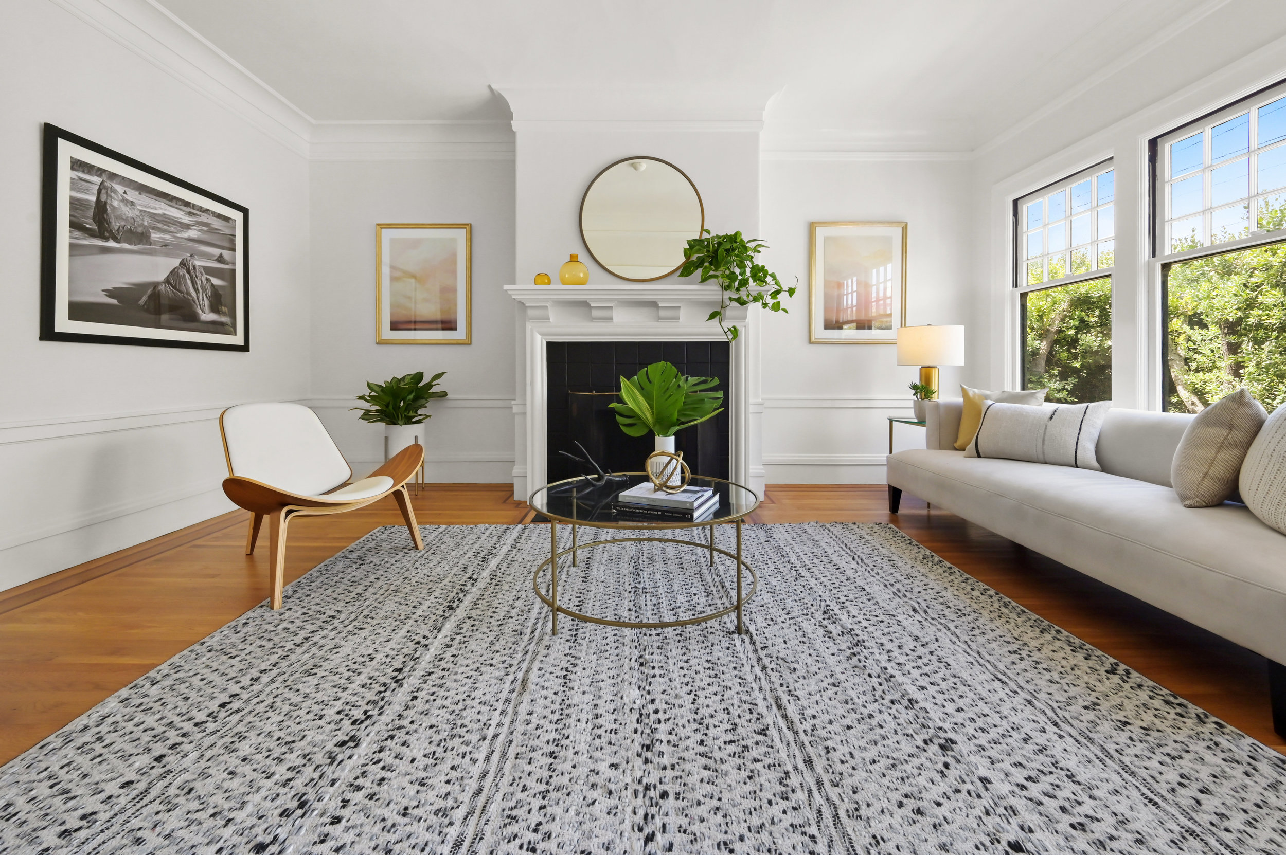 View of the living room showing a fireplace with white wood surround