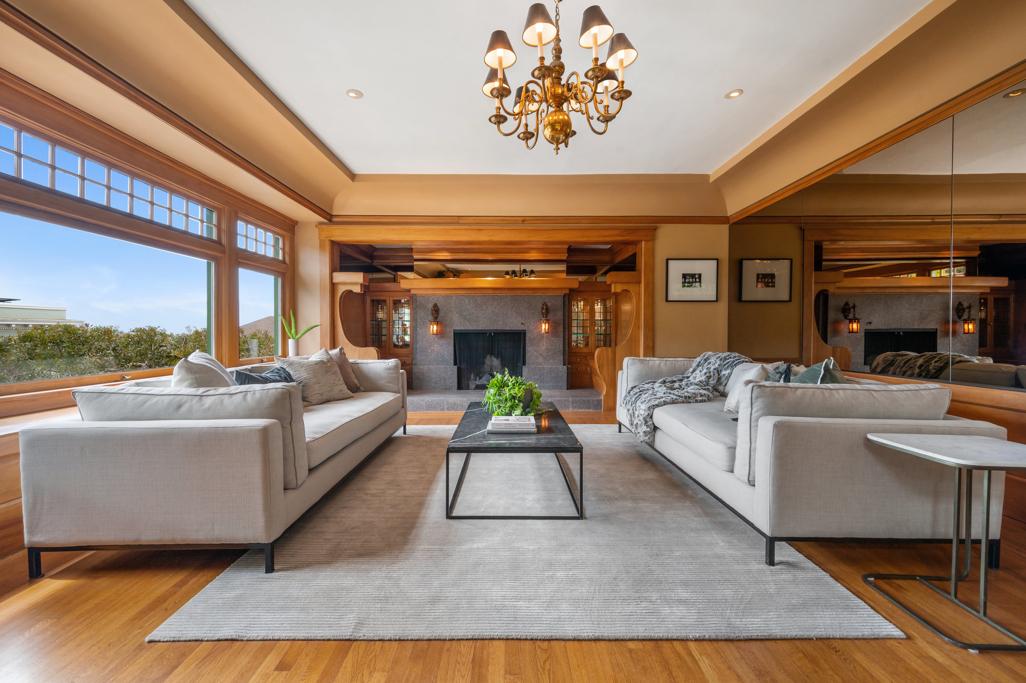 Living room featuring rich Craftsman architectural elements and woodwork