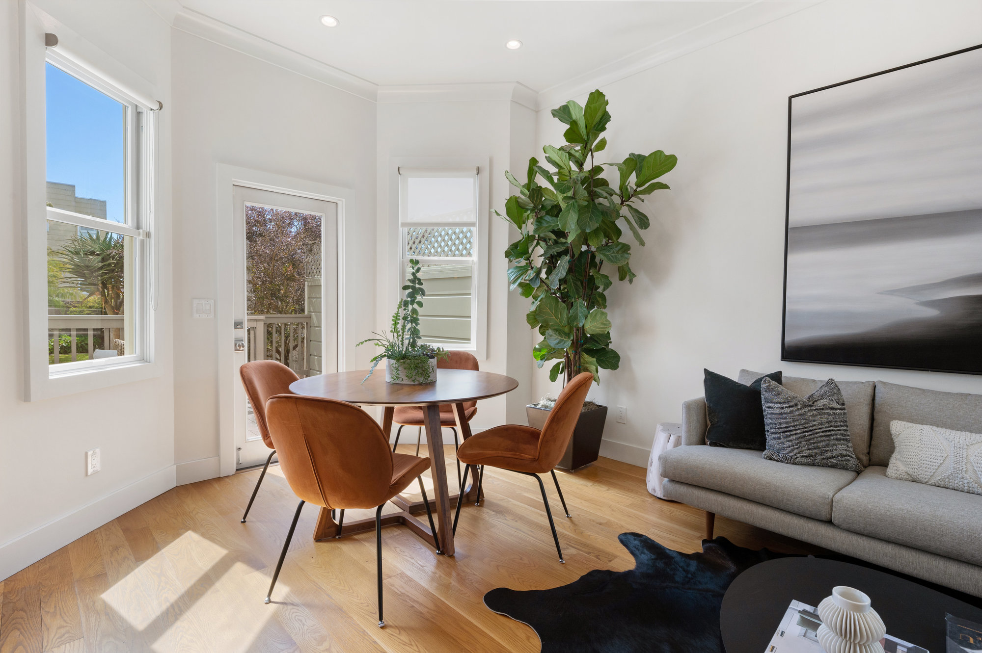 Dining and living area, featuring wood floors and lots of natural light