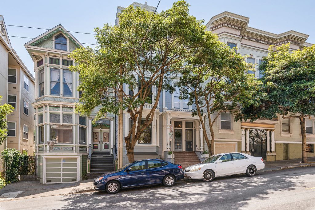 Front exterior view of 1271 McAllister Street, showing a Victorian home with blue facade