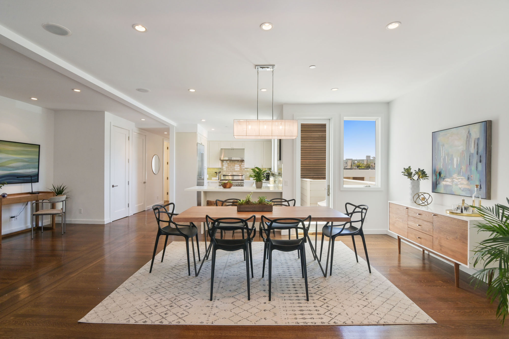 01318 View of a dining area, featuring wood floors, modern fixtures, and plenty of natural light