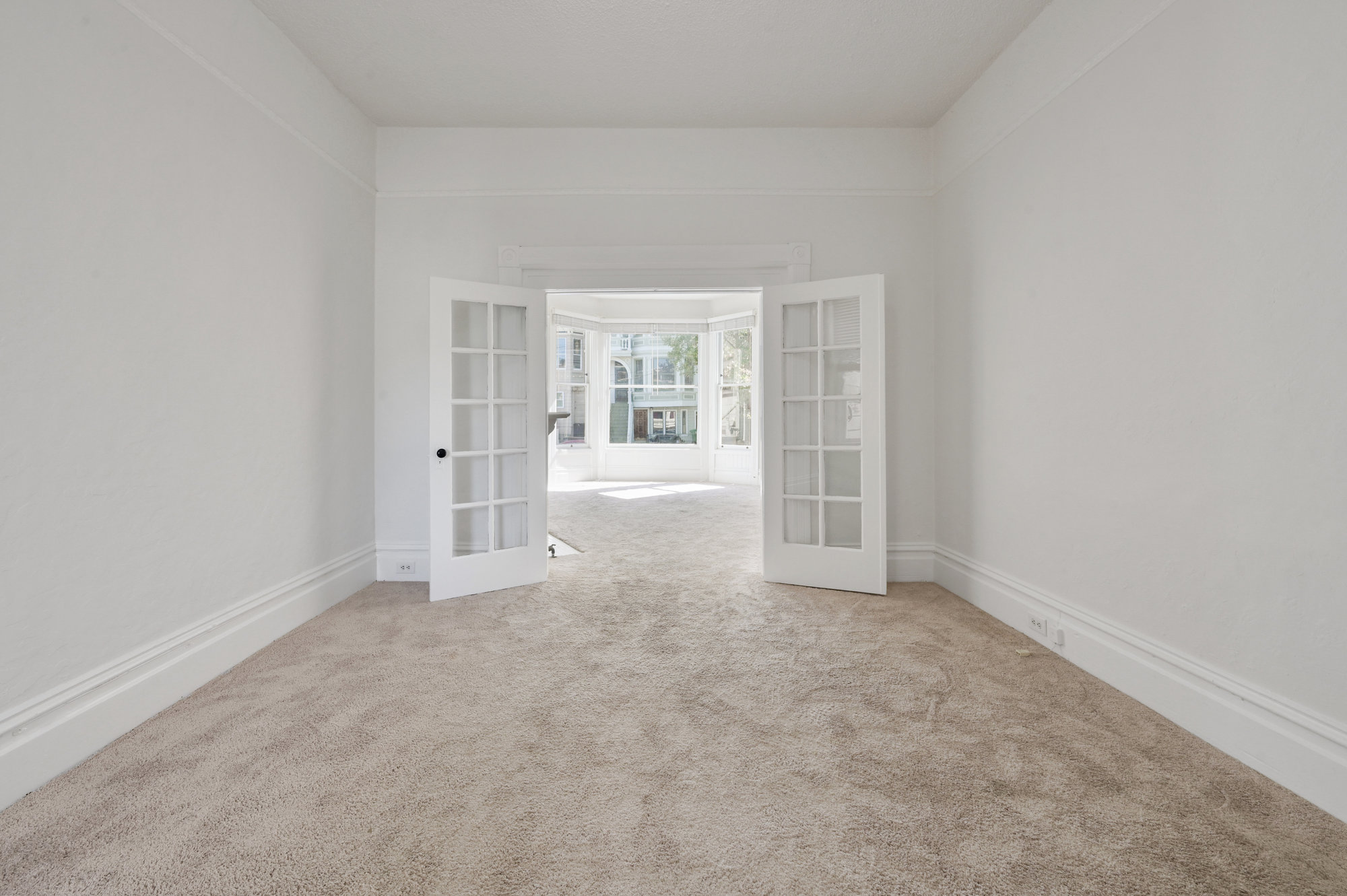 014013 Long view of a living area, featuring french doors