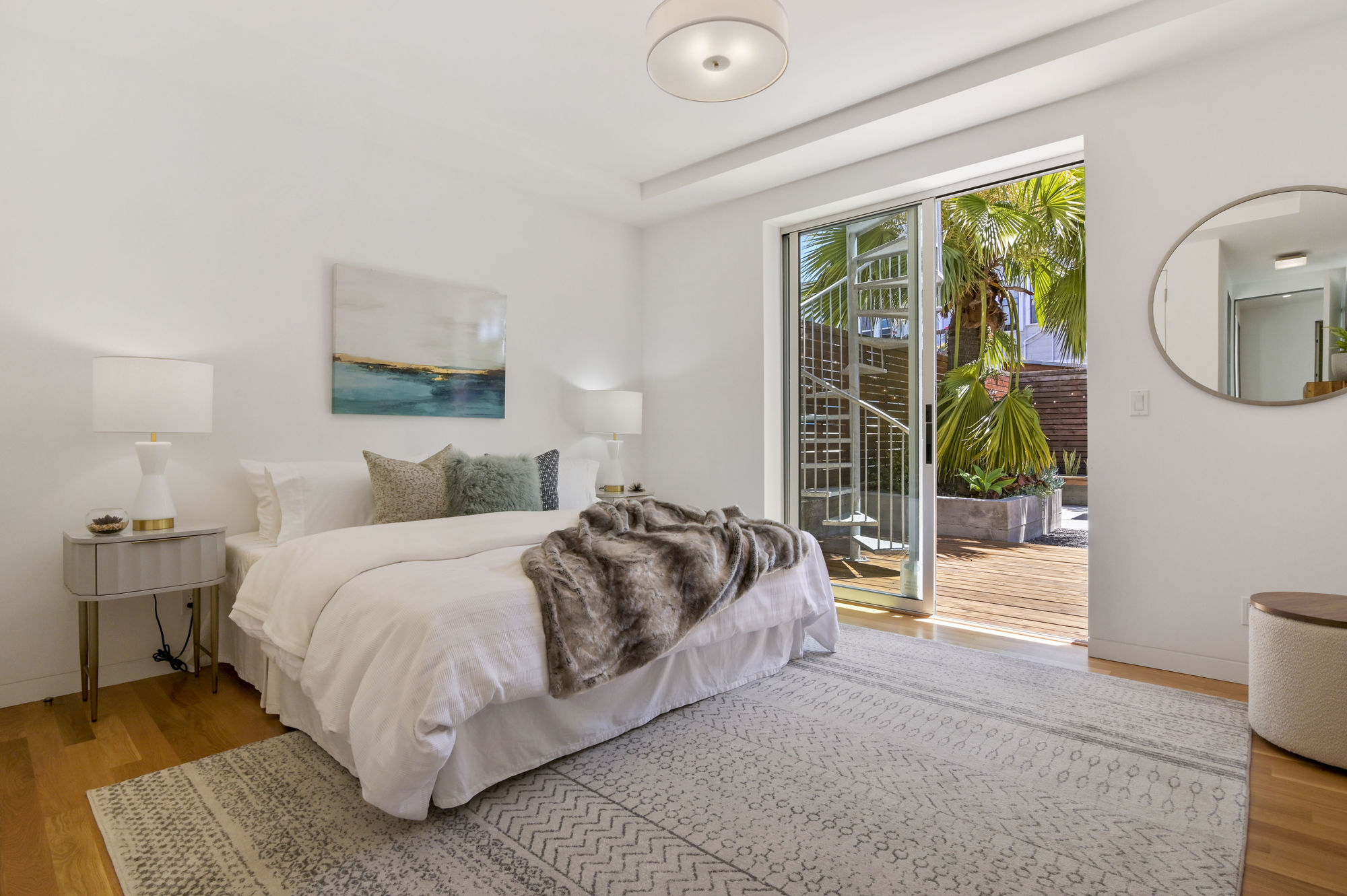 01421 View of a bedroom overlooking the outdoor living area and spiral staircase