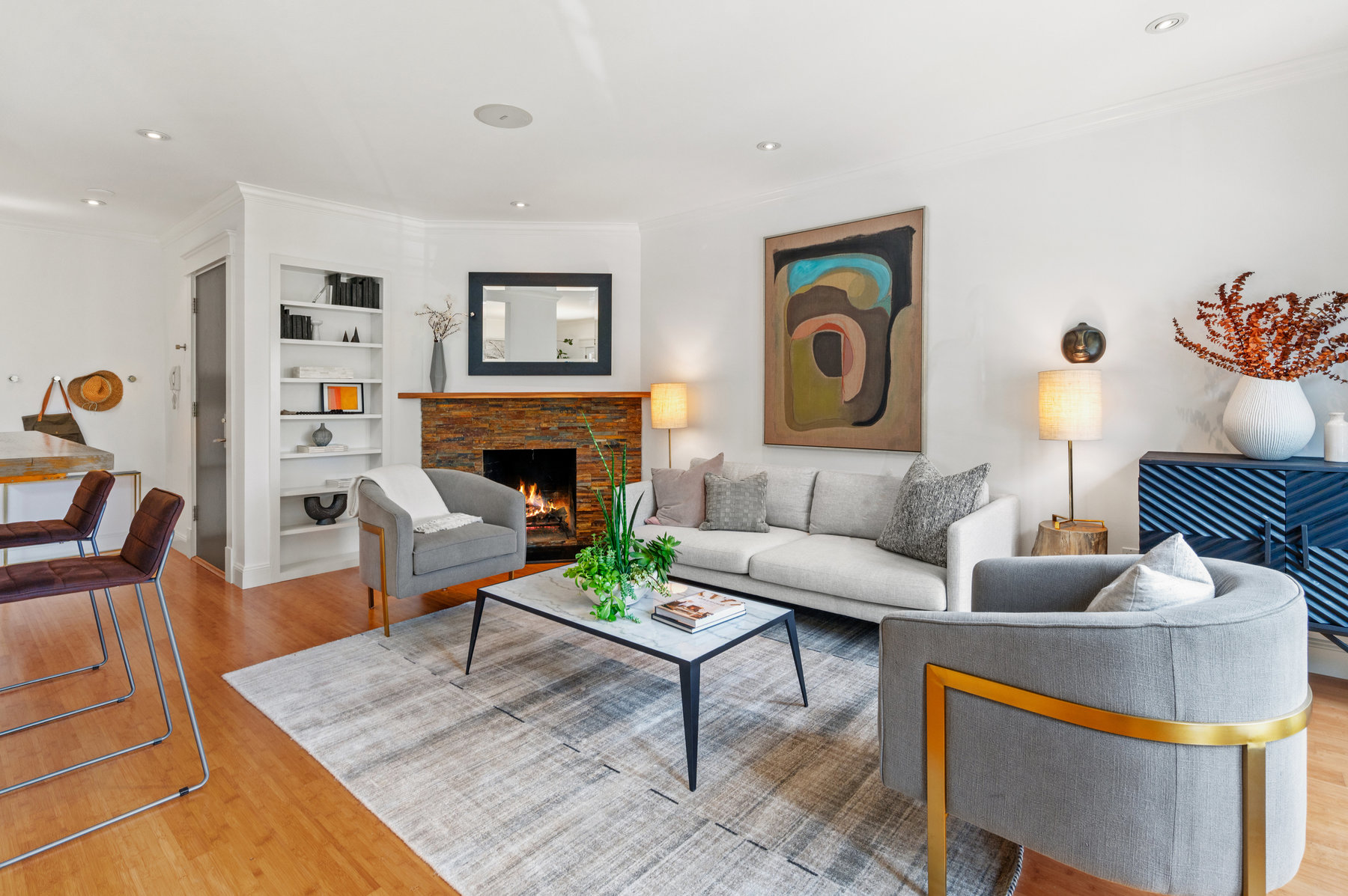 Looking over living room space towards entry way.