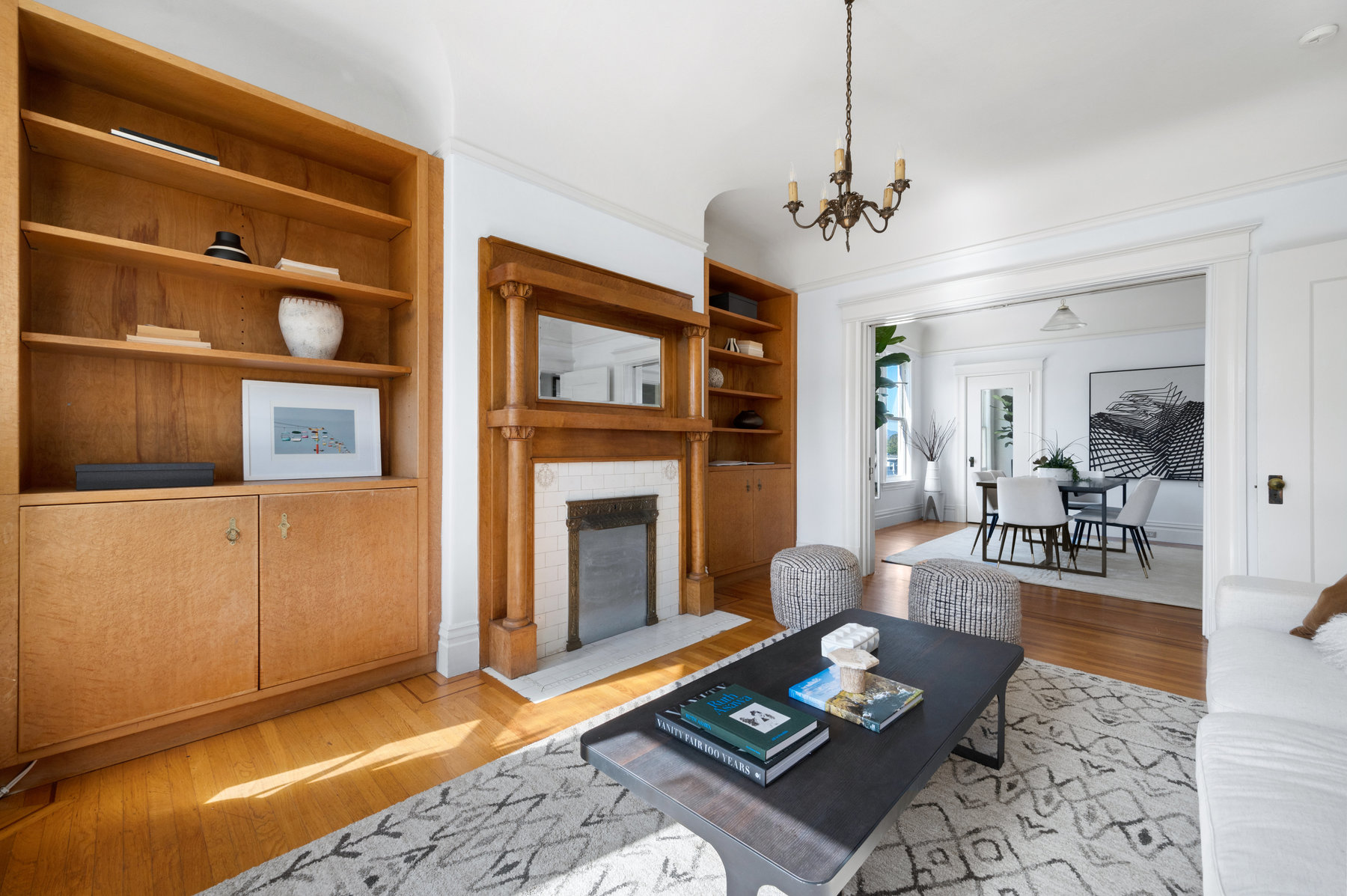 There are large built ins on both sides of fire place and wood detailed mantel.