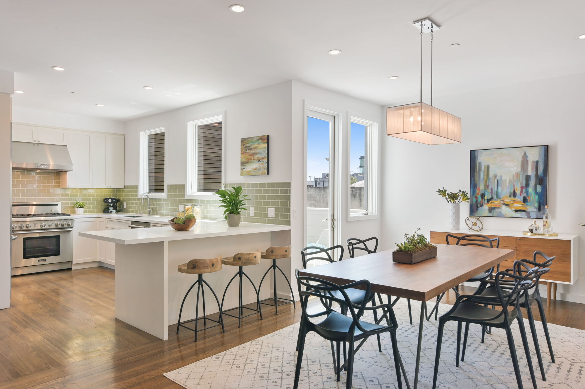 01724 Open floor plan view of the dining area and kitchen, featuring lots of natural light
