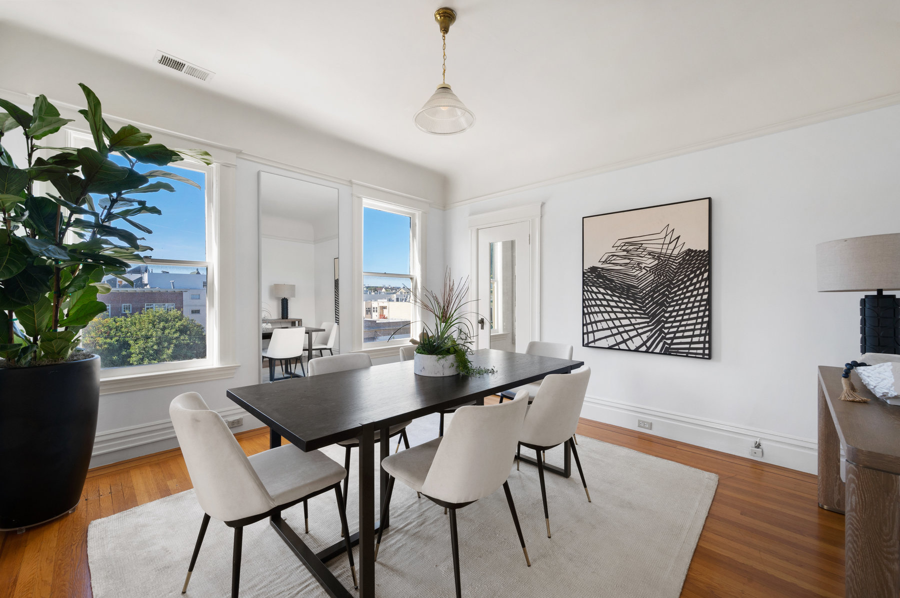 Formal dining room had rectangular table that seats 6. Large windows that let in lots of light.