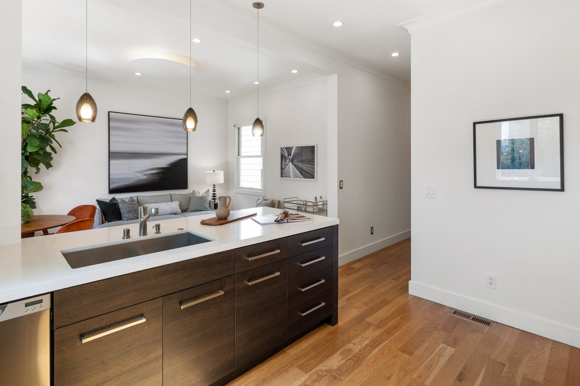 Kitchen with a view into the hall and living room beyond