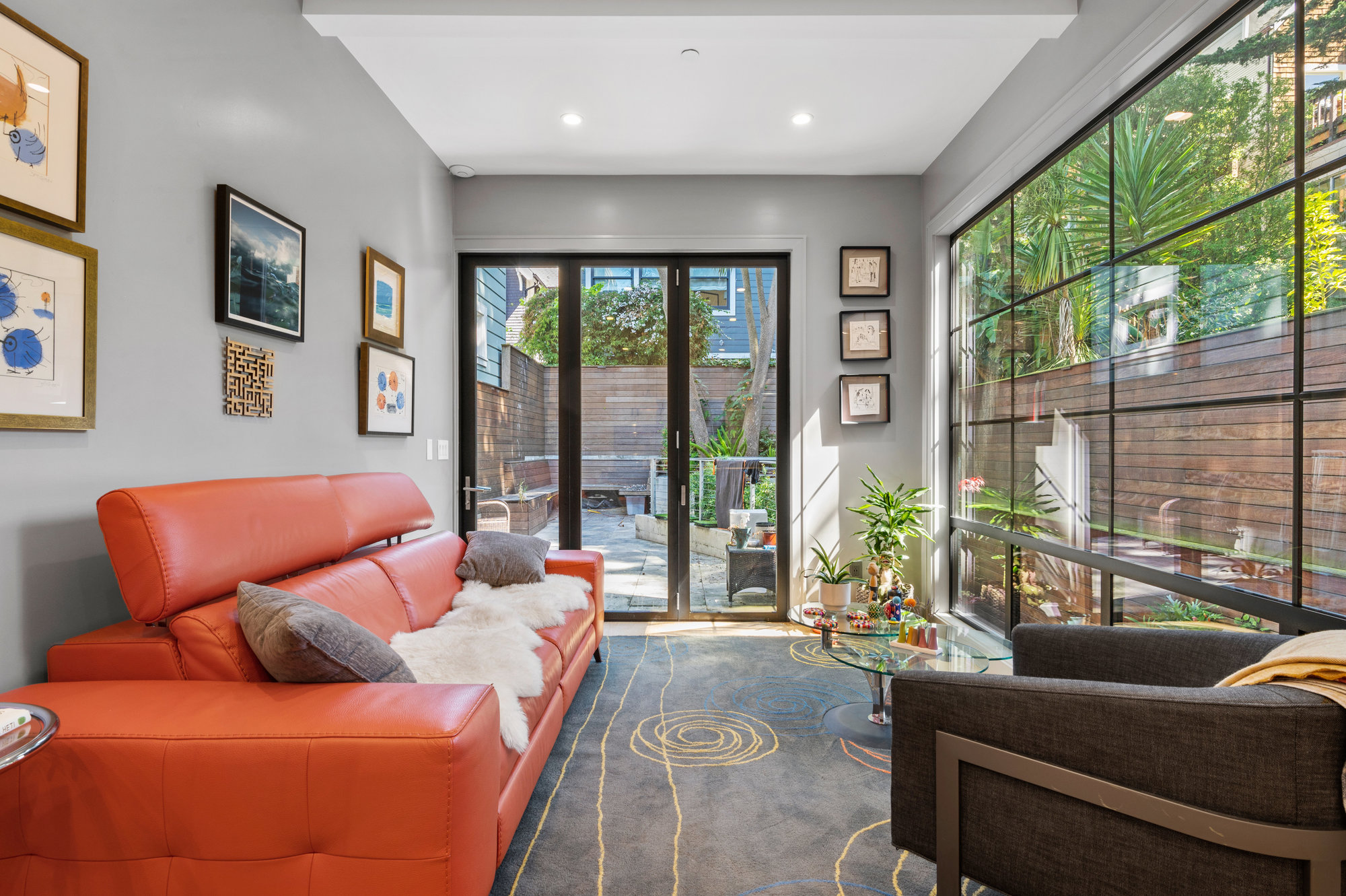 There is a glass door in living room that leads out to the yard that is exclusive to unit.