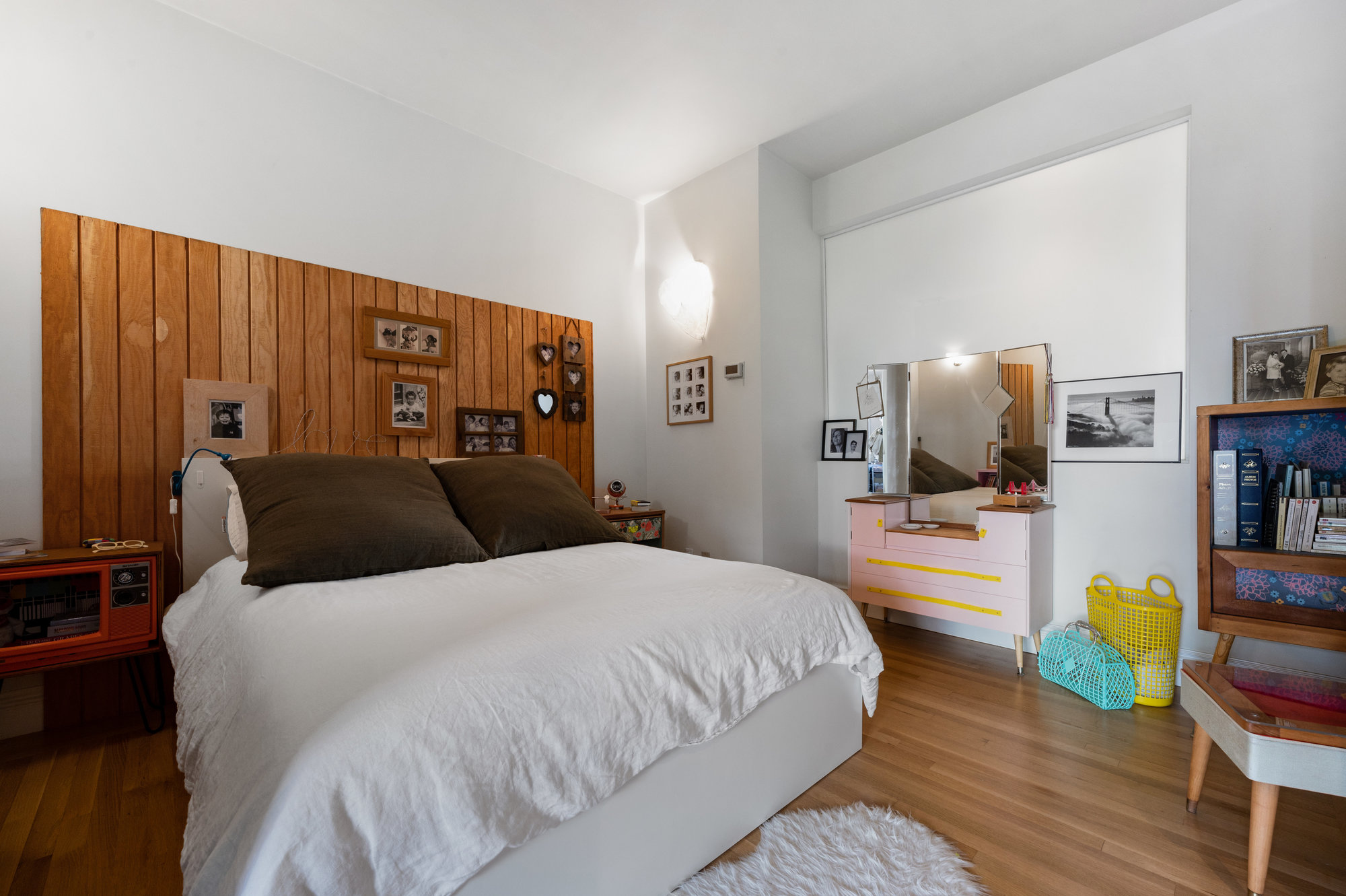 View of the primary bedroom featuring wood floors