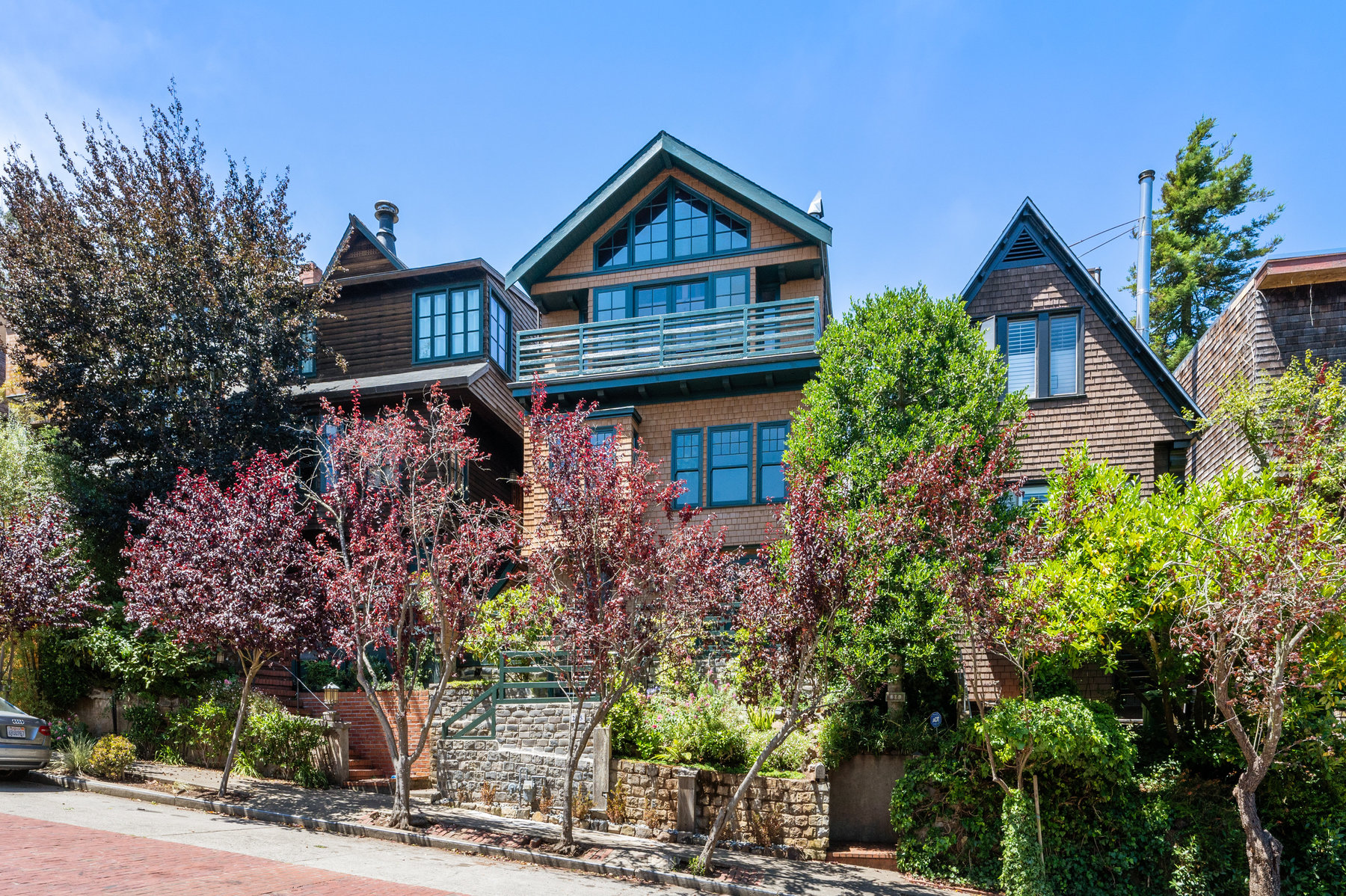 Street view of 205 Edgewood, showing a large single-family home with wood shingles
