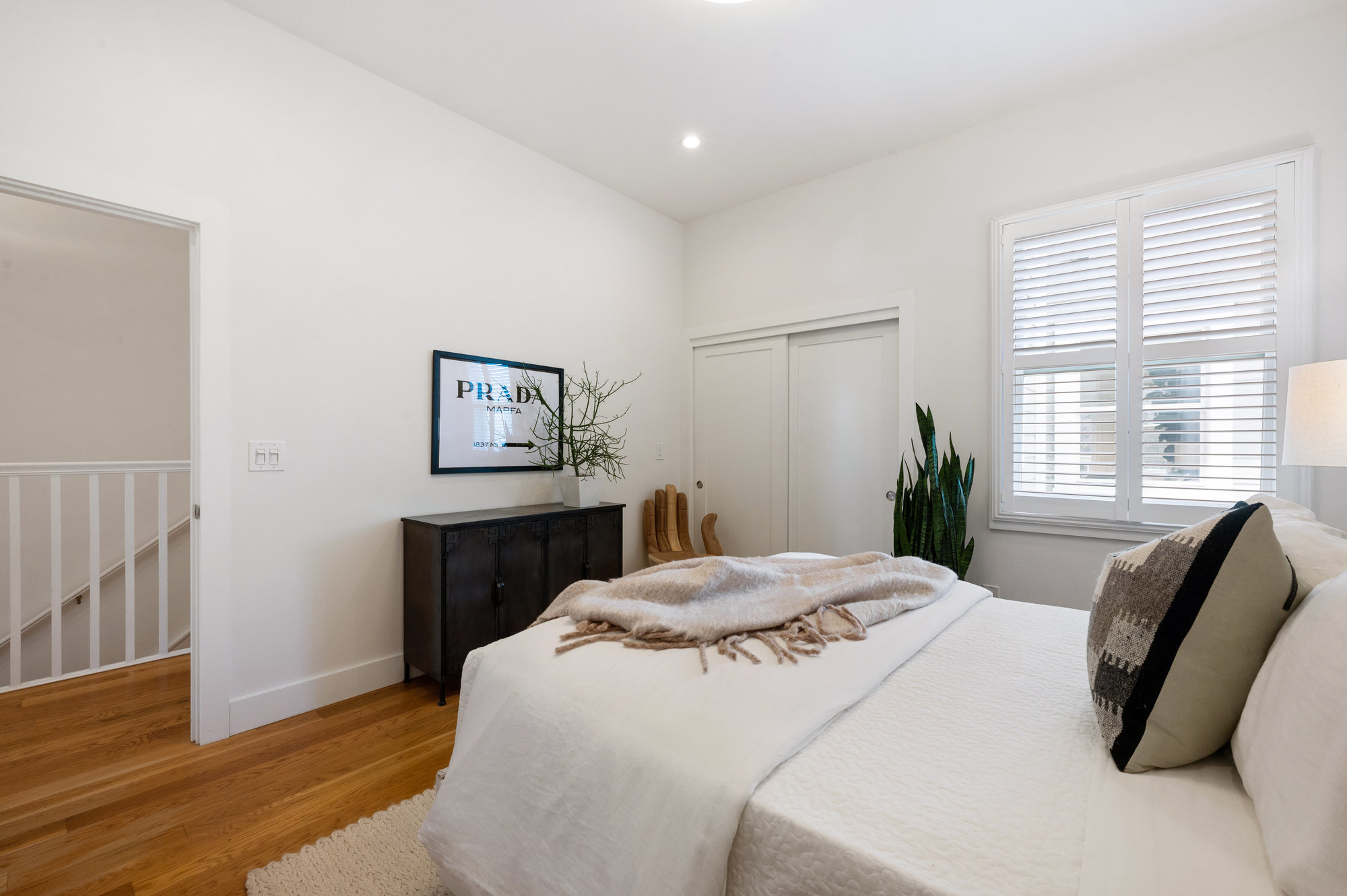 Bedroom two, showing wood floors and recess lighting