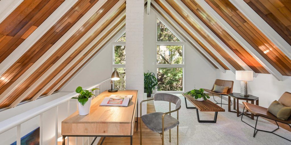 View of a living area with exposed wood ceilings