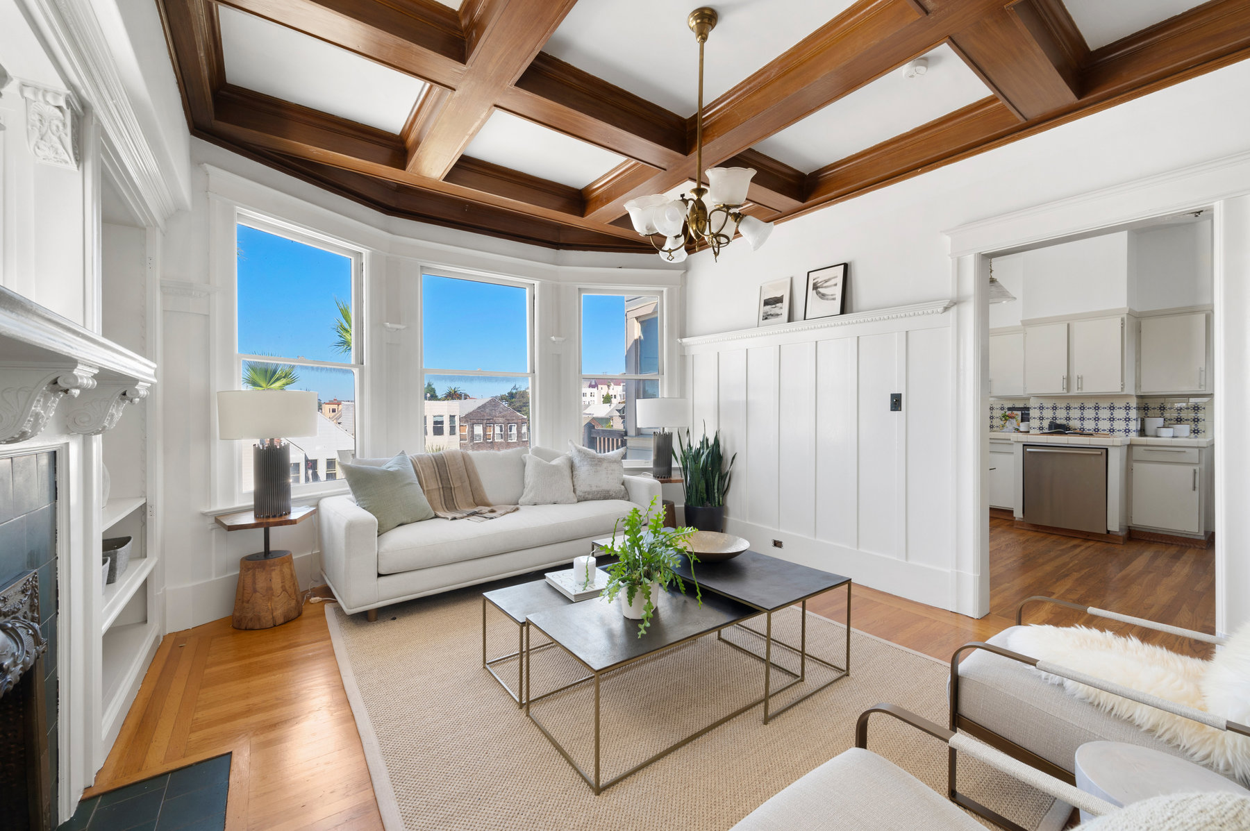 Back living room has stunning would beam detail on ceiling. The doorway leads to kitchen.