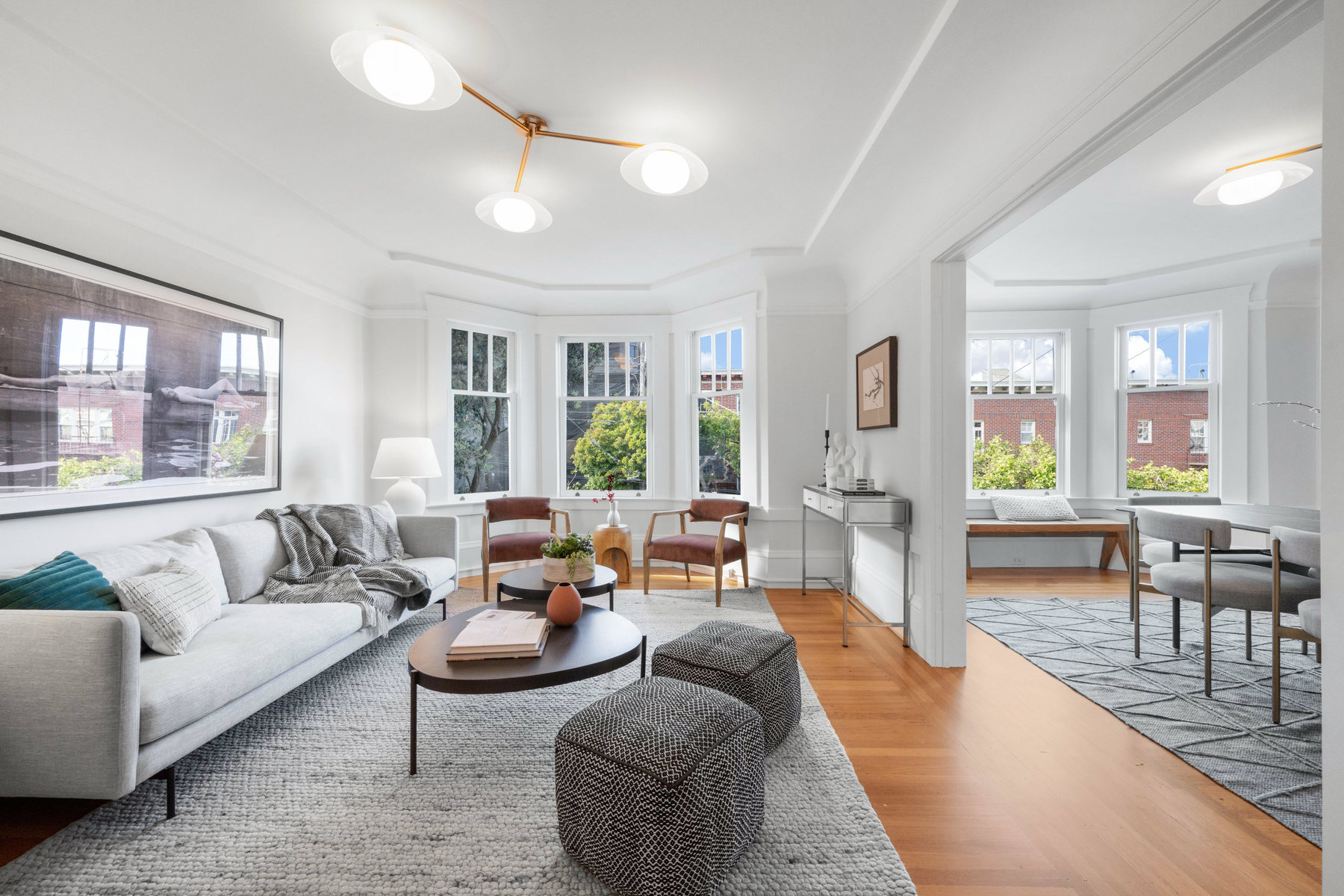 Living room with large windows and wood floors