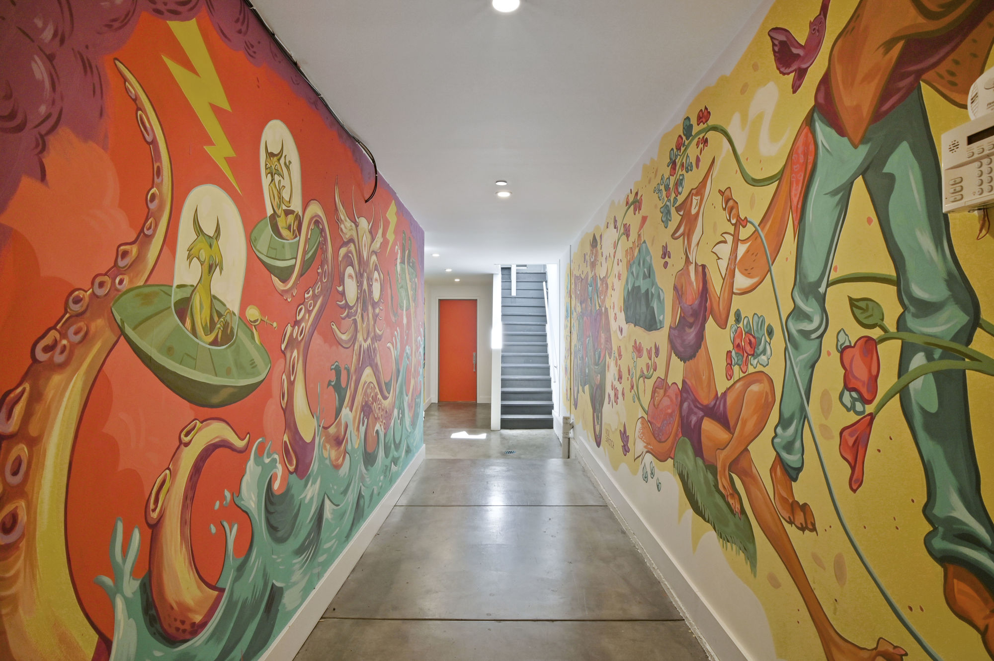 02838 View of the hall leading to 45-49 Belcher Street, featuring walls with colorful painted art-work