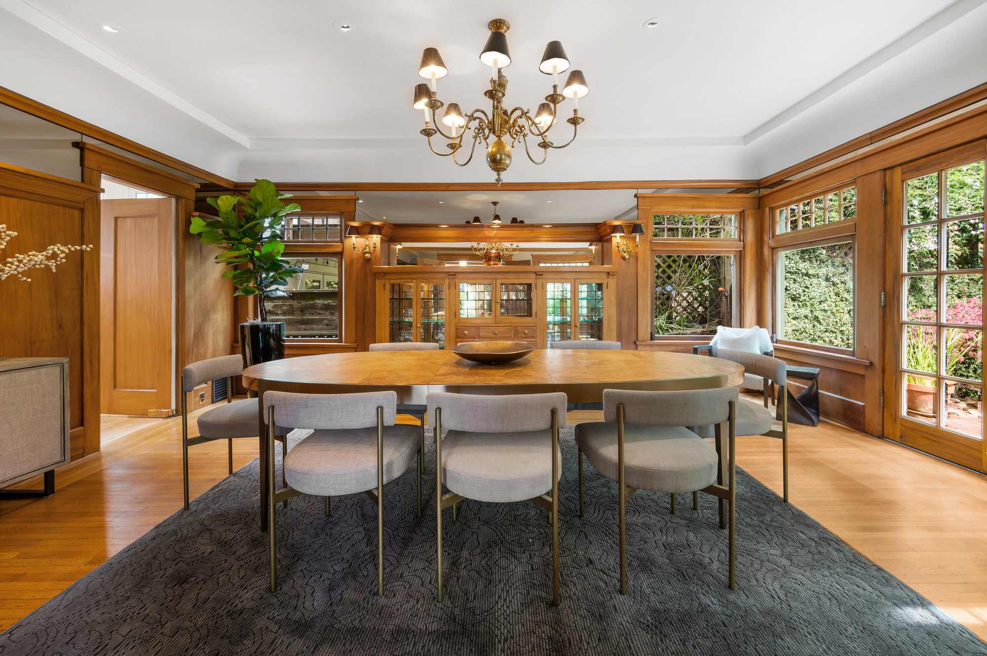 Formal dining room with wood framed doors and large windows
